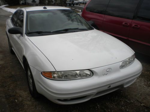 White, 4 door, alloy rims. new tires many new parts