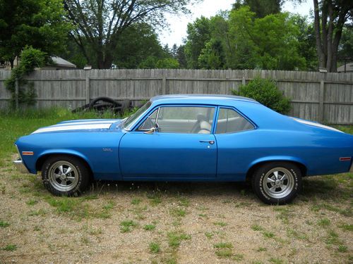 1970 chevrolet nova blue with rally stripes, and custom interior