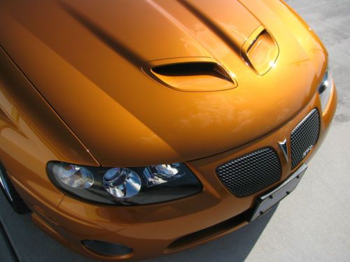 2006 brazen orange gto automatic (still smells new!)