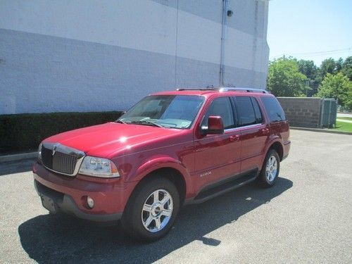 Leather moonroof heated seats chrome wheels third row seat 4x4