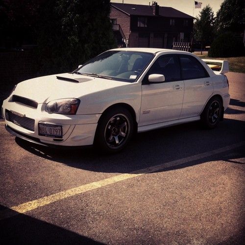 2005 subaru wrx sti includes two sets of wheels and new tires, and nav w/ ipod