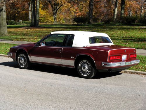 13,000 original miles, absolute best available, red, white carriage top, new!