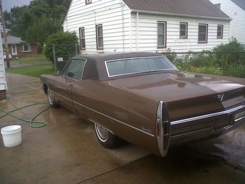 Brown, tan leather interior, vinyl top, solid car