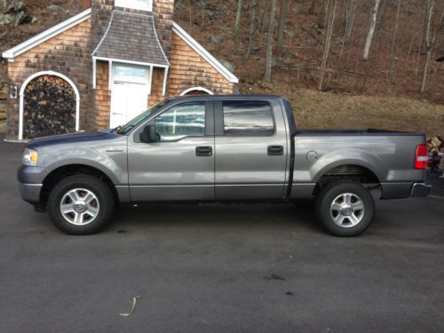 Ford f150 xlt crewcab 4x4 5.4 v8, new plow, and sander included.