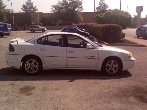 Fully loaded white pontiac grand am gt sport  fair condition