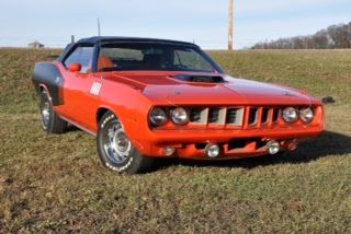 1971 plymouth cuda convertible, orange with black top, orange and black interior