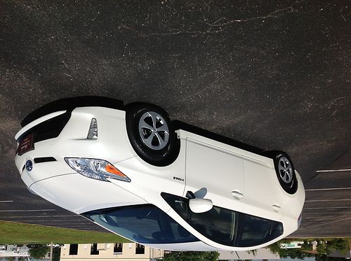 2012 toyota prius 4. pearl white on tan leather.