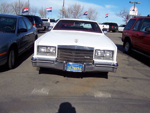 A nice white 1985  cadillac eldorado with red leather interior