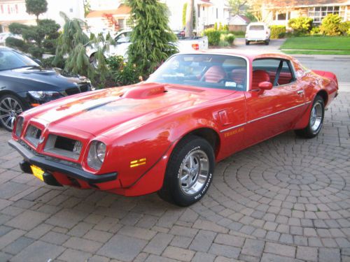 1975 trans am 4speed buccaneer red/red&amp; black built 385 c.i./410hp orig 400 6.6