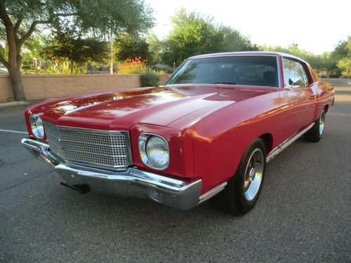 '70 red ss 454 monte carlo with black interior, bucket seats, center console