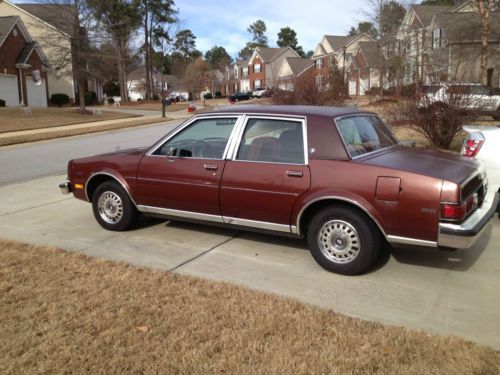 4 door sedan, maroon, red interior, 99500 mi, single owner