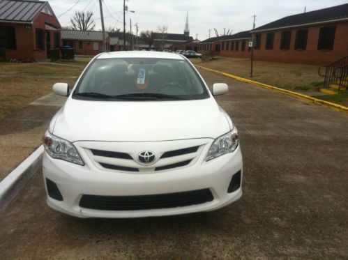 White 2011 toyota corolla le