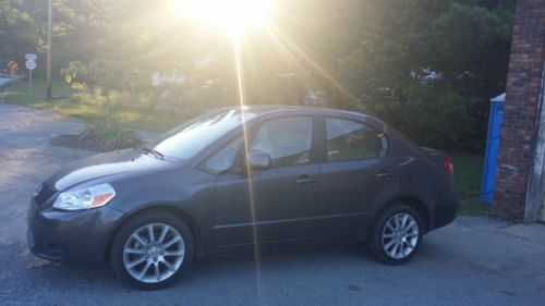2011 suzuki sx4 le anniversary edition sedan 4-door 2.0l 27,041 miles