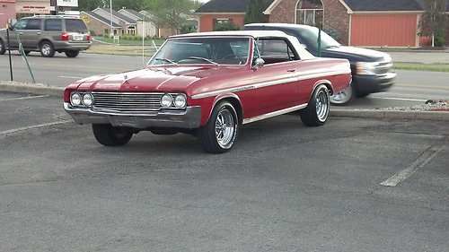 64 red and white convertible