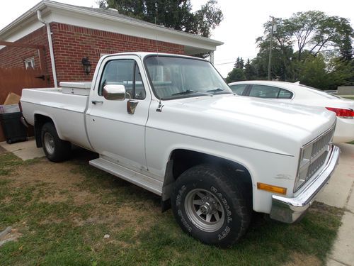 82 chevy c-10 4x4 pick up, v8, 4 speed manual. strong engine and drivetrain.