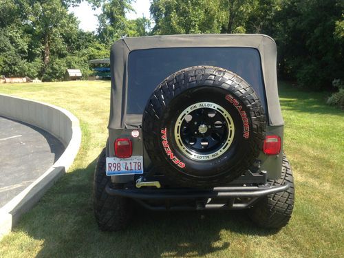 1990 jeep wrangler, 4' lifted suspension, newer 35" grabbers including spare
