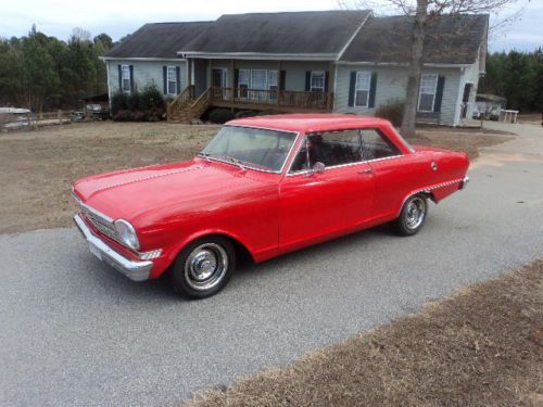 1964 chevy 2 nova  red in color, 327 engine. run and drives good.