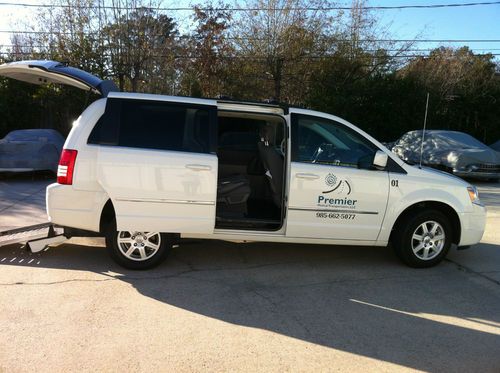 Excellent condition, white, 5 door wheelchair conversion van with ramp