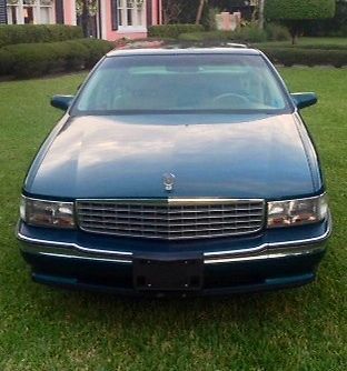 1994 blue caddy w/white leather int looks new.