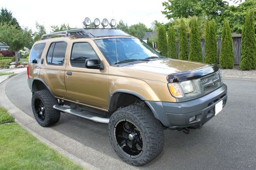 2000 nissan xterra xe sport utility 4-door 3.3l - 12" lift with huge tires