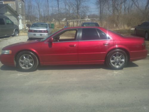 Red 2002 cadillac sts four door sedan in great condition