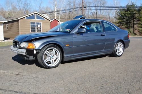 Body man special..hit front, drives fine..2001 bmw 330ci..5 spd man. no reserve