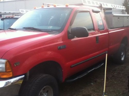 2000 f350 extended cab 160k 8ft bed with side tool boxes and rack