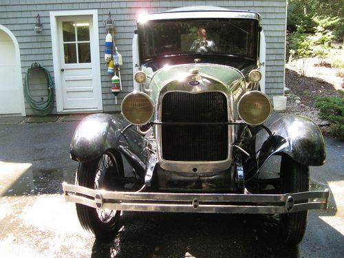 Green body, black fenders, good condition and running, older restoration,