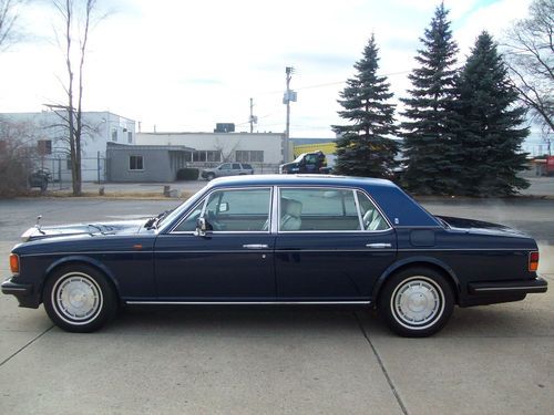 Royal blue w/cream interio w/blue pipeing sun roof in rear