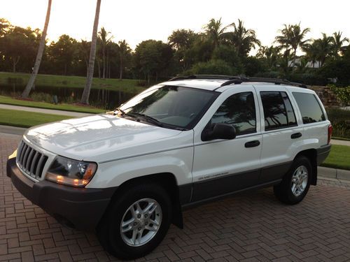 2004 jeep grand cherokee laredo white/tan 61 k miles excellent condition clean