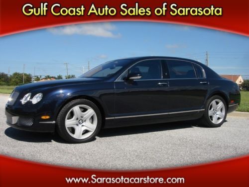 2006 bentley nav!  35k  tan  wood trim!