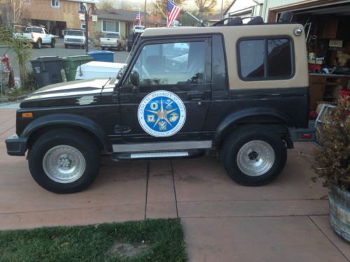 87 suzuki samuari 4x4 black good condition lift kit tires and rims. bluetooth