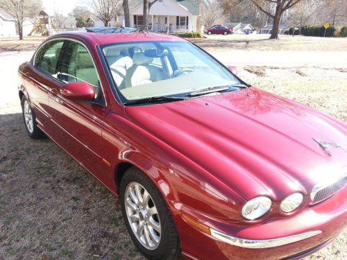 2003 carnival red jaguar sedan