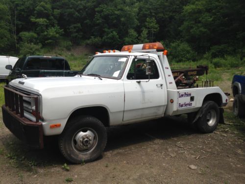 1990  d-350 cummins 12v 5 speed diesel 120k miles 4x4 1st gen wrecker tow nice !