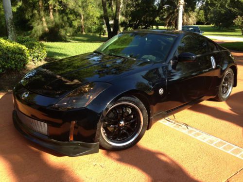 350z with custom paint, custom rims, custom exhaust and pioneer sub