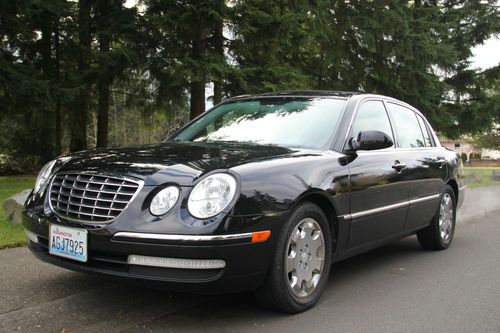 Kia amanti 2008 26,000 miles black on black.