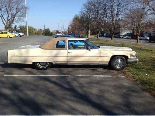 Vintage 1976 cadillac deville 2 door, cream w/gold interior, very good condition