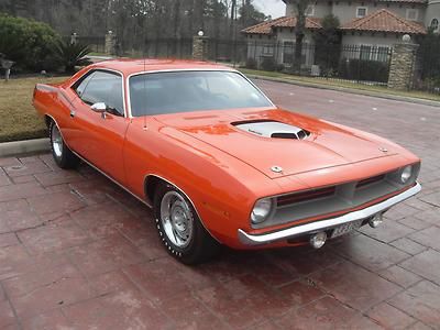 Cuda: 440 six pack, shaker, 4 speed, track pak, tor-red, govier rep., pristine!!