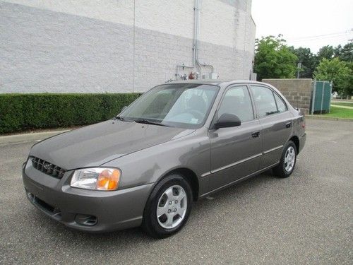 Low miles 4 door sedan 4cyl front wheel drive