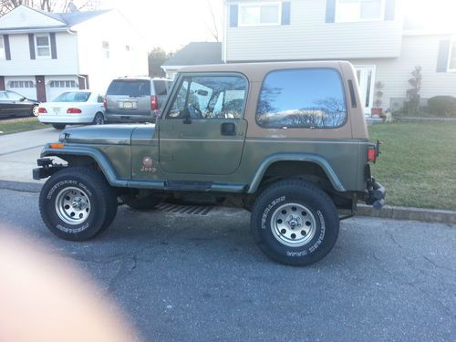 92 jeep wrangler sahara 5sd 6 cyl ac 2 tops only 80804 miles  everthing works
