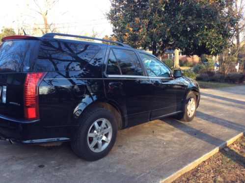 Awd cadillac srx 4 all leather with moon roof and 3rd row seating